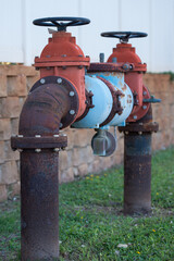 Fototapeta na wymiar large red and bown metal water valve