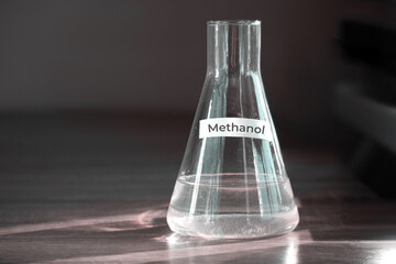 Methanol in a glass flask. Sunlight passes through the bulb and creates refraction. Methanol...
