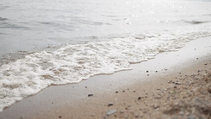 closeup shot of waves rolling on a beach on Baltic Sea