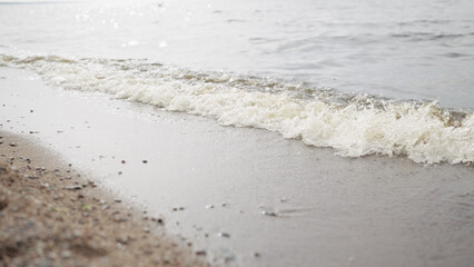 closeup shot of waves rolling on a beach on Baltic Sea