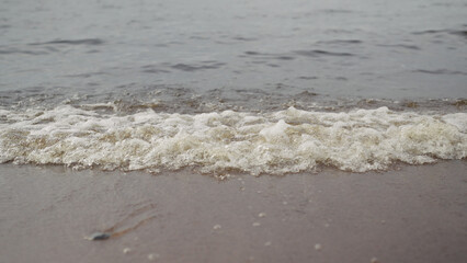 closeup shot of waves rolling on a beach on Baltic Sea