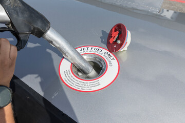 Fuel nozzle filling up aircraft