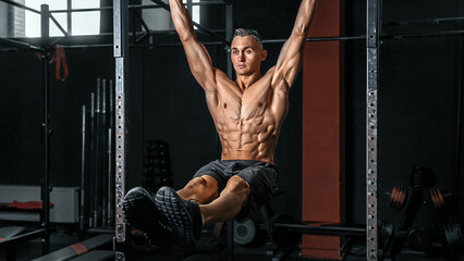 an athlete on a horizontal bar does exercises on the press