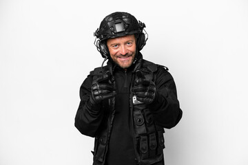 Middle age SWAT man isolated on white background pointing to the front and smiling