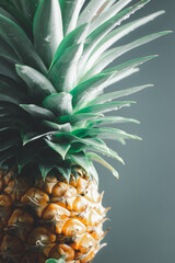 soft lighting on part of pineapple on vintage gray space background 
