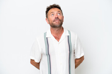 Fototapeta premium Middle age caucasian man isolated on white background and looking up