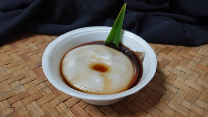 Bubur sumsum, rice porridge with palm sugar and pandan leaf