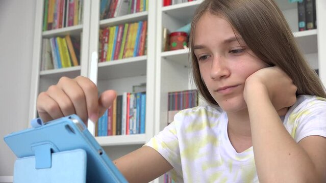 Kid Playing Tablet Browsing Internet, Child Learning on Touchscreen Device, Teenager Girl Studying for School, Online Gaming