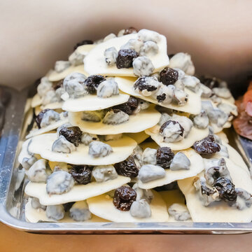 white chocolate with prunes a stack of sweets close-up