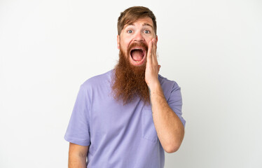 Young reddish caucasian man isolated on white background with surprise and shocked facial expression