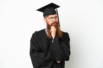 Young university graduate reddish man isolated on white background having doubts and thinking