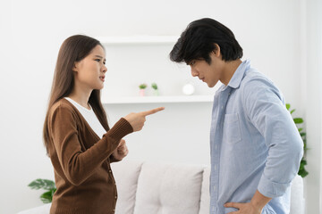 Family problems, Asian couple quarrel together at home. woman angry on man and man feel annoy.