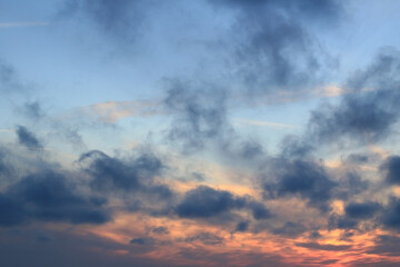 Fototapeta na wymiar stunning evening sky, blue rainy clouds and sunlight