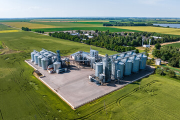 aerial view on agro silos granary elevator on agro-processing manufacturing plant for processing...