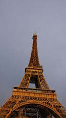 Golden Eiffel Tower lit by the sunset 