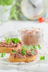 Homemade and aromatic bruschetta with fegatini and parsley as snack.