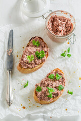 Crisp and hot bruschetta with fegatini and parsley as snack.