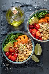 Fit salad with groats, chickpeas, arugula and vegetables.