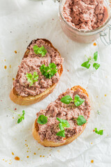 Homemade and aromatic bruschetta with fegatini and parsley for breakfast.