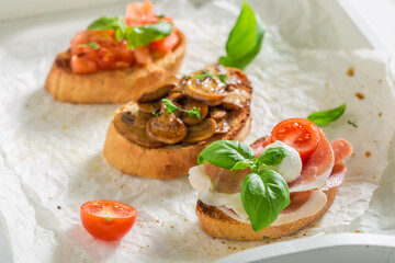 Tasty mix of bruschetta with fresh ingredients for breakfast.