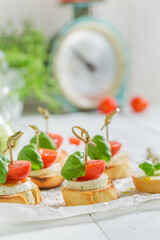 Hot and crisp crostini made with mozzarella and tomatoes