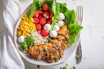 Healthy Caesar salad in the fit version with groats.