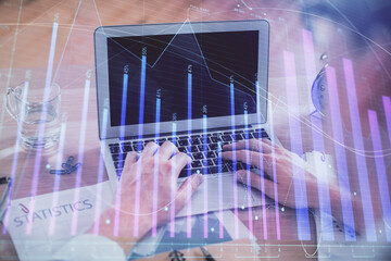 Multi exposure of forex graph with man working on computer on background. Concept of market analysis.