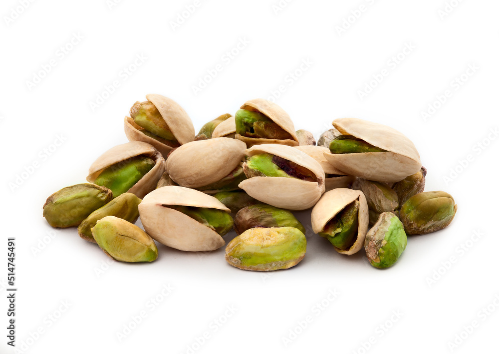 Wall mural pistachio nuts. many pistachios isolated on white.