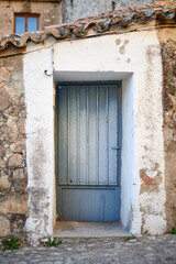Fototapeta na wymiar Old, picturesque main front door in mediterranean region house