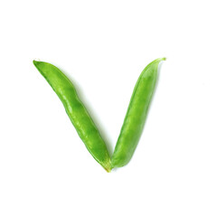 alphabet from vegetables, the letter from peas folded V on a light background