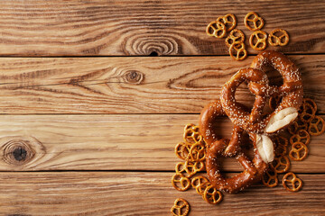 Oktoberfest concept with pretzel and blue simbol flag on wood background