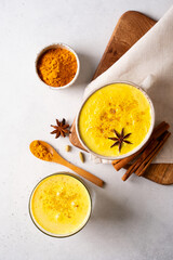 Turmeric health latte with spice and powder on white background,