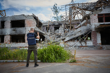 War correspondent photographs destroyed buildings after the bombing