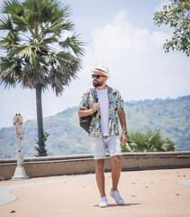 Young traveler man at summer holiday vacation with beautiful mountains and seascapes at background