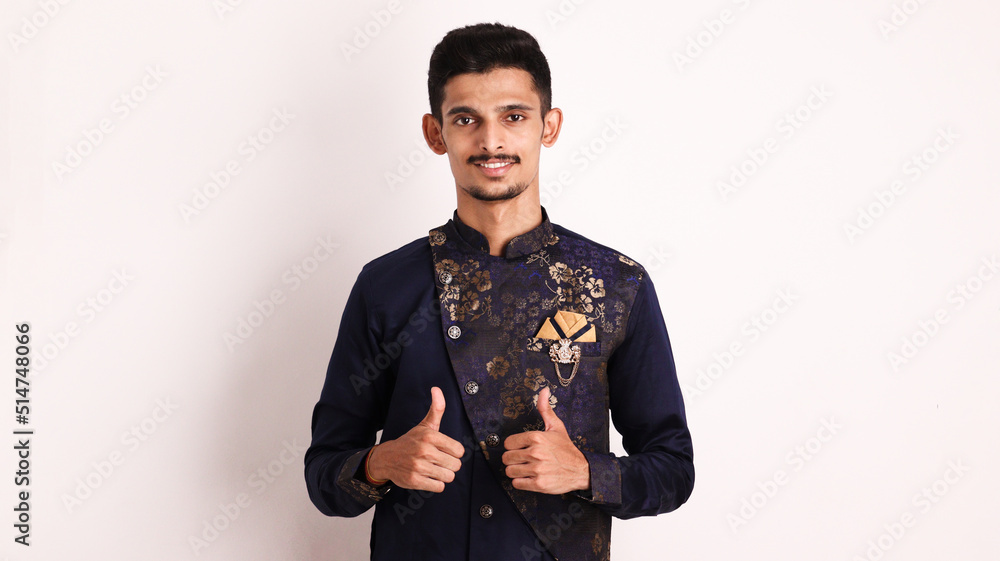Wall mural indian collage boy wears ethnic or traditional outfit kurta / cloths. male fashion model in sherwani - Wall murals