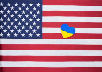 yellow - blue heart of Ukraine lies on the American flag. Solidarity of America and Ukraine in war against Russia. Friendly and partnership relations between countries. stop war. stand with Ukraine