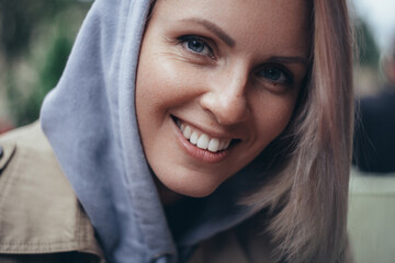 portrait of young fashion beautiful blonde woman in hood