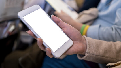 Mockup of smartphone during flight trip. Mock up ready for your design preview