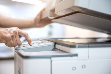 Photocopier printer, Close up hand office man press copy button on panel to using the copier or...
