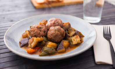 steamed meatballs with stewed vegetables with haze on plate