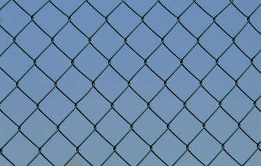Fototapeta na wymiar chain link fence with blue sky