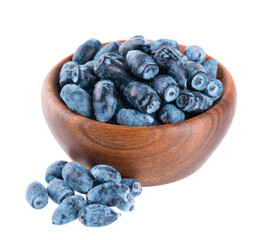Honeysuckle berries in wooden bowl, isolated on white background. Ripe berries of honeysuckle. Clipping path.