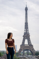 Young girl in the foreground with the eiffel tower in the background