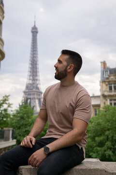 Young boy in the foreground with the eiffel tower in the background