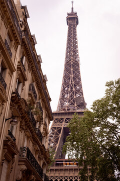 Photograph of the eiffel tower on a street in paris