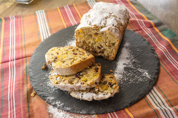 Fruitcake Loaf cake on a black plate. food concept
