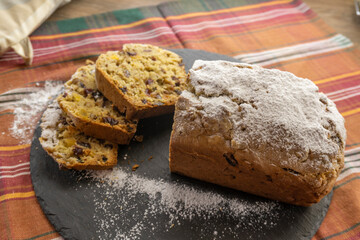 Fruitcake Loaf cake on a black plate. food concept
