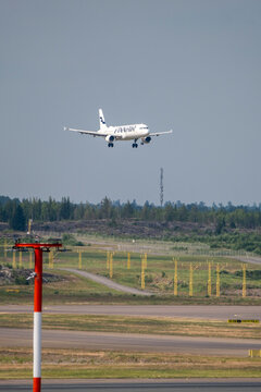 An Airbus airctaft, operated by the Finnish flag carrier Finnair, landing at Helsinki Airport
