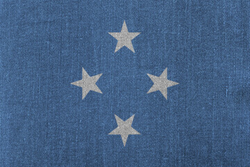 Patriotic classic denim background in colors of national flag. Micronesia