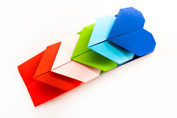 paper heart made of origami paper isolated on white background. love concept